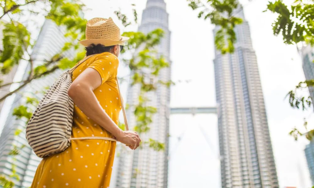 Tourist in Kuala Lumpur keeping her things safe