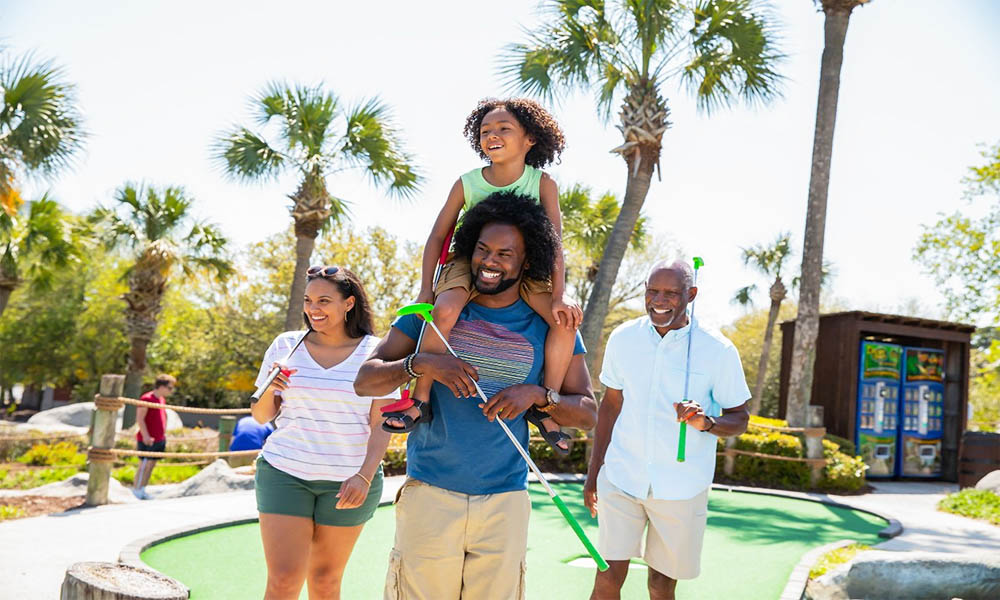 A family at a mini golf course.