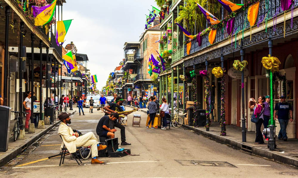 Live performance in the heart of the New Orleans jazz scene with brass band musicians and local crowd